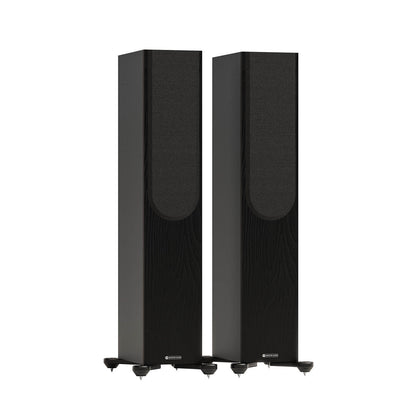 Monitor Audio Bronze 300 7G in Black, angled view with grilles