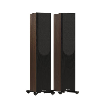 Monitor Audio Bronze 300 7G in Walnut, angled view with grilles